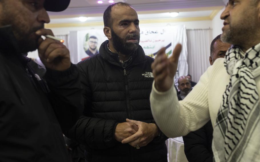 “My son was executed. I know nothing can bring him back, but I’m telling you this because maybe someone else’s kid can be saved,” said Hafeth Abdel Jabbar, shown here speaking with others as they arrive for Tawfic’s wake. M