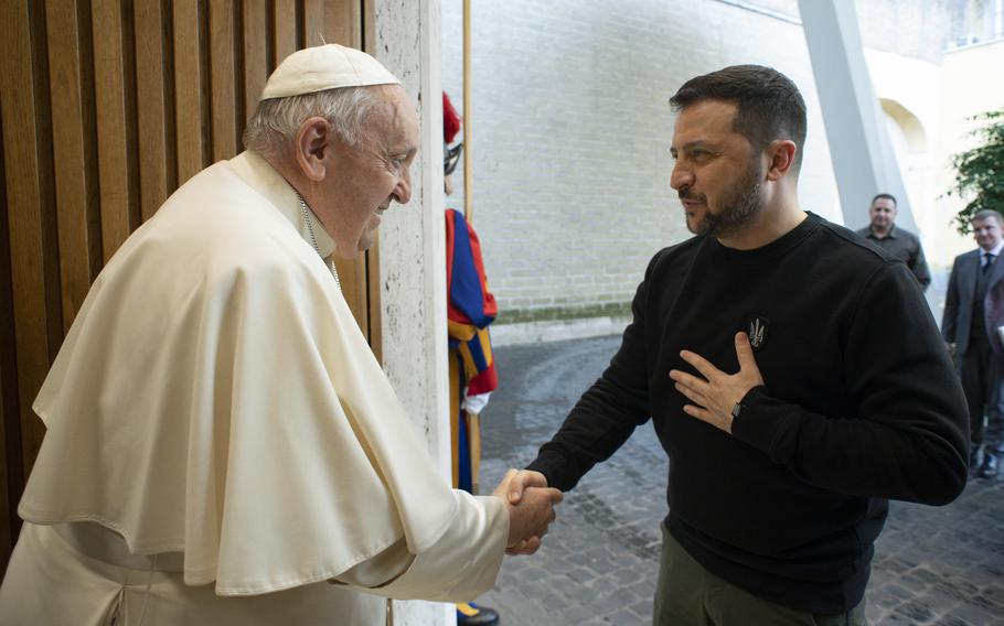 This image made available by Vatican News shows Pope Francis meeting Ukrainian President Volodymyr Zelenskyy during a private audience at The Vatican, Saturday, May 13, 2023. Francis recently said that the Vatican has launched a behind-the-scenes initiative to try to end the war launched last year by Russia. 