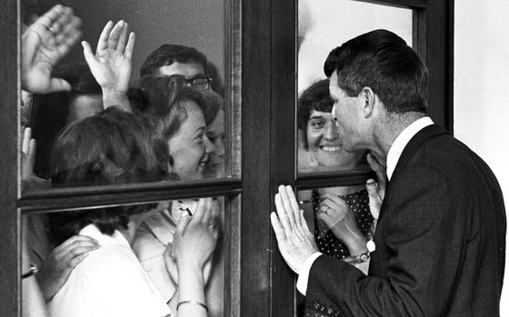 Heidelberg, Germany, June, 1964: Attorney General Robert Kennedy greets some admirers at the Heidelberg University auditorium. Kennedy answered questions on a wide range of topics, including Vietnam, civil rights and the upcoming presidential election. Asked about the surging popularity of eventual Republican nominee Barry Goldwater, Kennedy called the Arizona senator a spokesman for "people who oppose everything ... They want schools, good government and atomic weapons but they just don't like the people in Washington who are providing these things."

Looking for Stars and Stripes’ historic coverage? Subscribe to Stars and Stripes’ historic newspaper archive! We have digitized our 1948-1999 European and Pacific editions, as well as several of our WWII editions and made them available online through https://starsandstripes.newspaperarchive.com/

META TAGS: Robert Kennedy; RFK; presidential elections; European tour; Germany; 