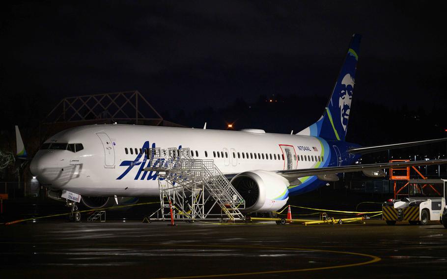 A plastic sheet covers an area of the fuselage of the Alaska Airlines N704AL Boeing 737 MAX 9 aircraft outside a hangar at Portland International Airport on Jan. 8, 2024 in Portland, Ore. 