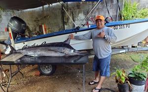 The U.S. Coast Guard has suspended its seven-day search for missing boater Jeffrey Hattori, seen here showing off a catch in front of his 14-foot skiff, the Lady G. 