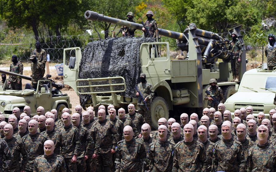 Fighters from the Lebanese militant group Hezbollah carry out a training exercise in Aaramta village in the Jezzine District, southern Lebanon, Sunday, May 21, 2023. The show of force came ahead of “Liberation Day,” the annual celebration of the withdrawal of Israeli forces from south Lebanon on May 25, 2000, and in the wake of a recent escalation of the Israel-Palestine conflict in the Gaza Strip.