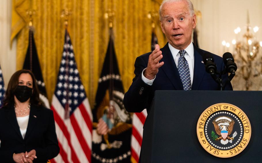 President Biden, with Vice President Harris by him, answers questions after delivering remarks regarding the Senate passage of the bipartisan infrastructure bill at the White House on Aug. 10, 2021. 