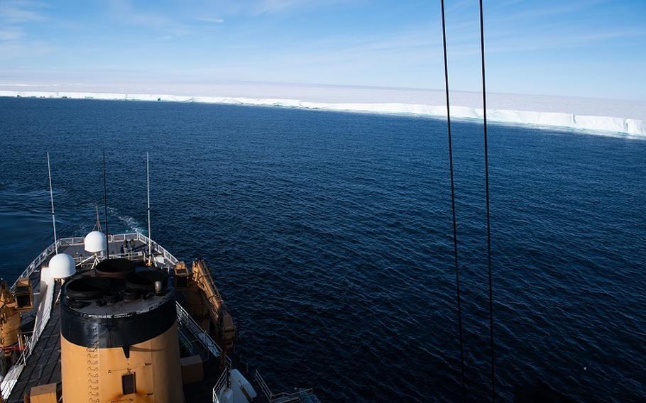 U.S. Coast Guard Cutter Polar Star transits away from the ice shelf near the Bay of Whales, Antarctica, Feb. 17, 2022. The service says it set a record for the southernmost transit for a ship.