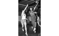 https://www.stripes.com/news/celtics-cousy-has-vital-role-as-player-representative-1.65596
Bob Myers/Stars and Stripes
Mannheim, Germany, September, 1955: Bob Cousy, right, takes a shot as Fuerstenfeldbruck player (and future University of North Carolina coaching legend) Dean Smith defends during the 1955 USAFE basketball clinic. According to a Stripes story about the clinic, Cousy's "dribbling exploits while demonstrating maneuvers here have several times brought forth spontaneous applause from the USAFE, Army and NATO coaches."
