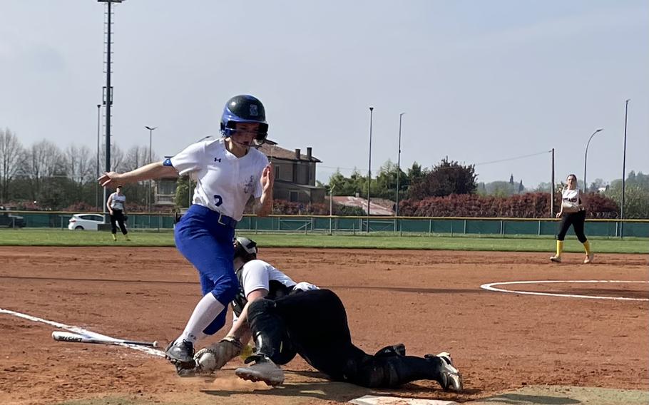 Ava Henson of the Vicenza Cougars tries to tag out Madisyn Orlowski of the Rota Admirals as she tries to score during the first of two games between the teams on Caserma Del Din, Vicenza, Italy April 6, 2024. Henson was unable to secure the throw from her teammate, allowing Orlowski to score the run. 