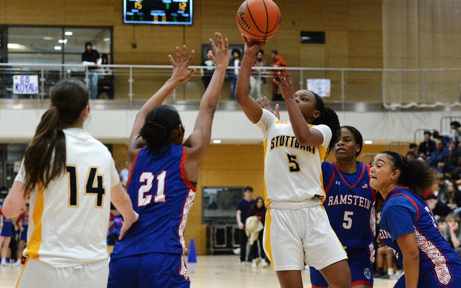 Stuttgart’s Macayla Hines shoots over Ramstein’s Feliciana Davis in the girls Division I final at the DODEA-Europe basketball championships in Wiesbaden, Germany, Feb. 17, 2024. Stuttgart dropped Ramstein 33-26 for the division title.