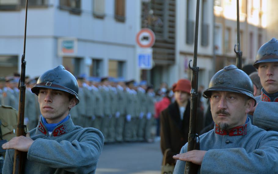 French World War I re-enactors stand outside the Cathedral Saint Etienne in Chalons-de-Champagne, France, Oct. 24, 2021. The city held events honoring the selection 100 years ago of the U.S. Unknown Soldier.   