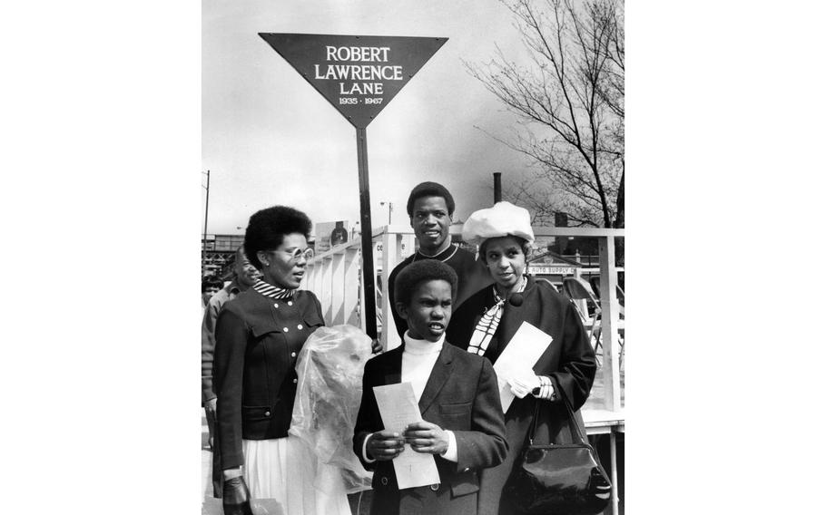 A Robert Lawrence Lane sign is dedicated to Air Force Maj. Robert Lawrence Jr. at 22nd and State streets in Chicago on April 25, 1969. The dedication was attended by Lawrence’s wife, Barbara; mother, Gwendolyn; son, Tracey, age 9; and Dathan Threatt of The Young Men of Pride, a neighborhood club that helped get the sign erected.