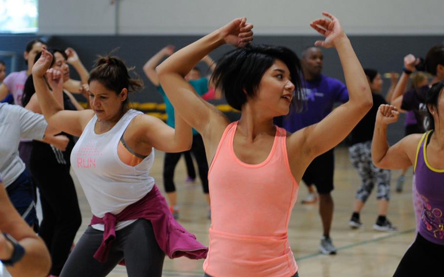 People dance during a Zumba class.