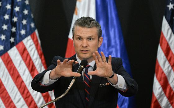 U.S. Secretary of Defense Pete Hegseth gestures during a joint press conference with Philippines' Secretary of National Defense Gilberto Teodoro after their meeting at Camp Aguinaldo in Manila on March 28, 2025. U.S. defense chief Pete Hegseth met Philippine President Ferdinand Marcos on March 28, saying the two countries must stand "shoulder to shoulder" in the face of the threat represented by China. Hegseth is expected to give a speech Saturday as military leaders including high-level representatives from China meet in Singapore starting Friday for the Shangri-La Dialogue.  (Ted Aljibe/AFP via Getty Images/TNS)