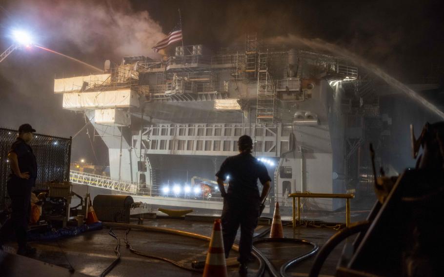 Sailors combat a fire aboard the amphibious assault ship USS Bonhomme Richard (LHD 6) on July 13, 2020, in San Diego. 