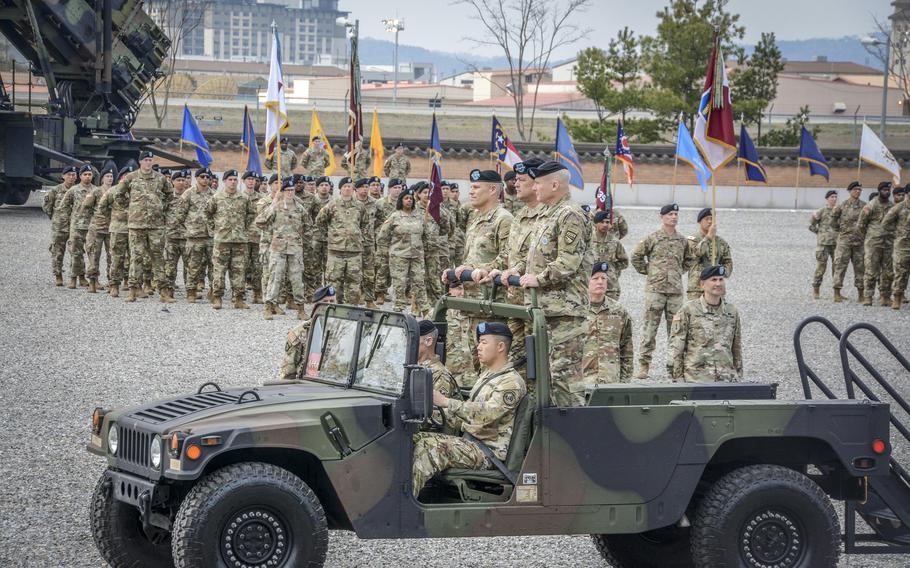 U.S. Forces Korea commander Army Gen. Paul LaCamera, outgoing Eighth Army commander Lt. Gen. Willard Burleson and incoming commander Lt. Gen. Christopher LaNeve inspect troops at Camp Humphreys, South Korea, Friday, April 4, 2024. 