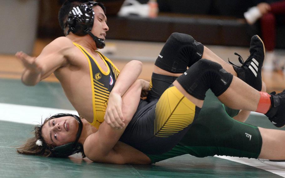 Kubasaki 152-pounder Nathan Voelkel gut-wrenches Kadena's Joseph Oh during Wednesday's Okinawa wrestling dual meet. Voelkel won by technical fall 12-2 in 1 minute, 58 seconds, but the Panthers won the meet 34-28, improving to 4-0 over the Dragons this season.