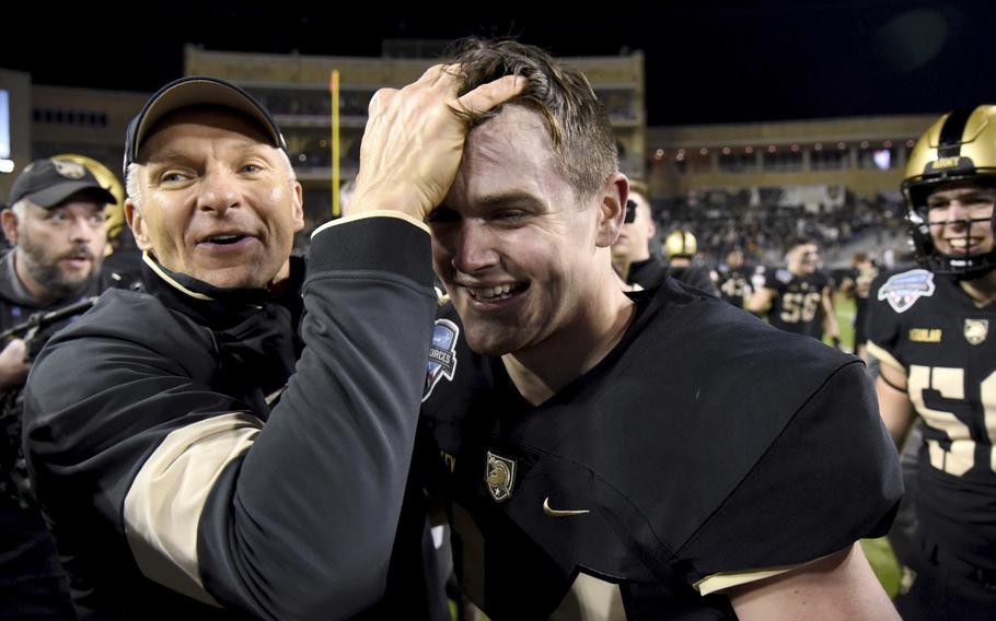 Army head coach Jeff Monken, left, celebrates with place kicker Cole Talley, right, who kicked a field goal in the closing seconds of their 24-22 win against Missouri in the Armed Forces Bowl NCAA college football game in Fort Worth, Texas, Wednesday, Dec. 22, 2021. 