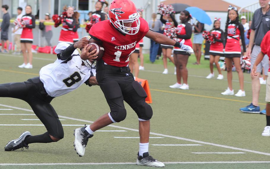 Nile C. Kinnick's Arashi Blocton pulls into the end zone with the touchdown that began the Red Devils' comeback.