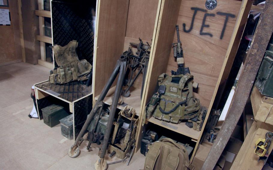 Tactical vests and weapons sitting in cubbyholes outside a secure room in the Al-Tanf garrison compound in Syria on June 21. 