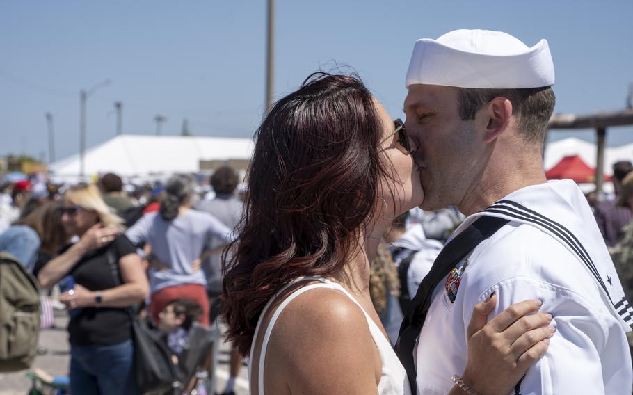 A sailor assigned to the USS George H.W. Bush embraces his partner after the ship’s return to Naval Station Norfolk, Sunday, April 23, 2023. 