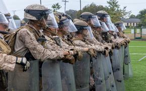 U.S. Marines with 2nd Battalion, 7th Marine Regiment, 1st Marine Division, attached to Task Force 51, rehearse non-lethal tactics in Los Angeles, June 11, 2025. U.S. Northern Command is supporting federal agencies by providing military forces to protect federal functions, personnel, and property in the greater Los Angeles area. On June 7, the Secretary of Defense directed USNORTHCOM to establish Task Force 51 to oversee Title 10 forces supporting this mission. (U.S. Marine Corps photo by Cpl. Jaye Townsend)