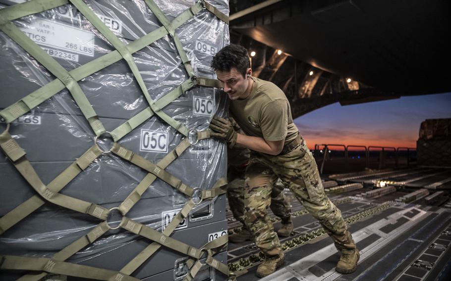 Senior Airman Garrett LaMarche, 6th Airlift Squadron loadmaster, pushes a cargo pallet onto a C-17 Globemaster III on Dover Air Force Base, Del., Feb. 7, 2023. More than 20 NATO states are dispatching emergency response personnel to Turkey to help those devastated by Monday’s earthquake. 