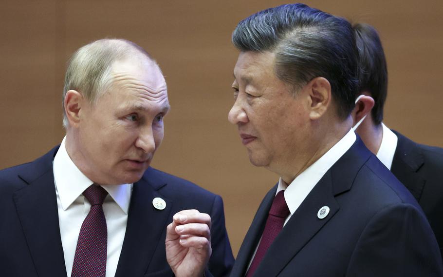 Russian President Vladimir Putin, left, and Chinese President Xi Jinping during the Shanghai Cooperation Organization summit in Samarkand, Uzbekistan, Friday, Sept. 16, 2022. 