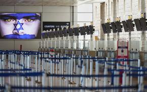 Israel's Ben Gurion Airport is empty of passengers following an Israeli military strike on Iran, in Lod, near Tel Aviv, Israel, Friday, June 13, 2025. (AP Photo/Ariel Schalit)