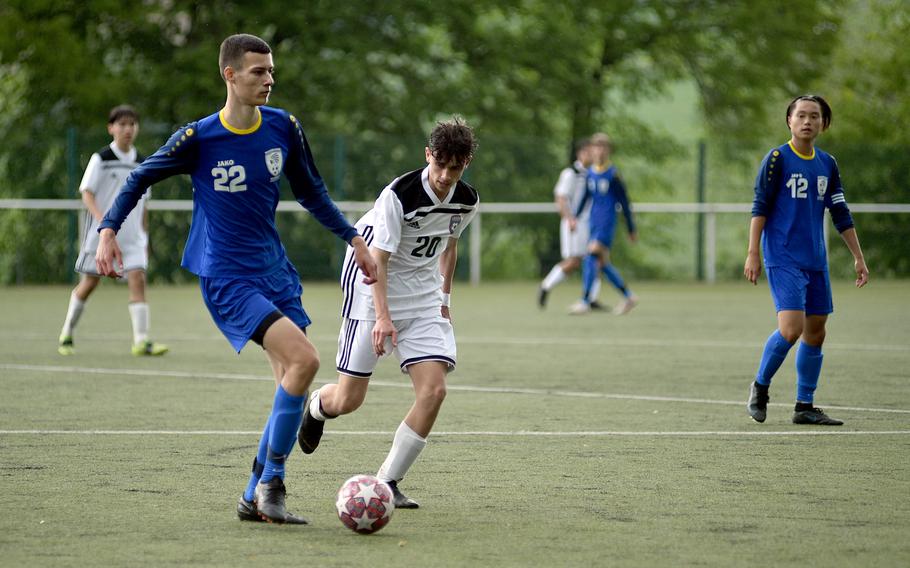 Wiesbaden's Ante Dugandzic, left, is pressured by SHAPE's Santiago Torrente de la Pisa during pool-play action on May 15, 2023, in Reichenbach-Steegen, Germany. The Warriors defeated the Spartans, 1-0.