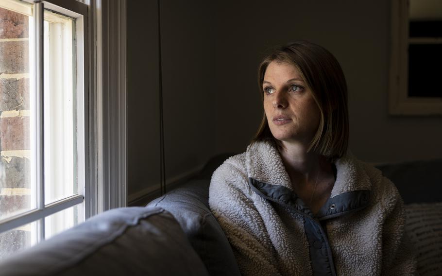 Megan Ernst sits for a portrait in her home in Virginia Beach, Va.,, on March 12, 2024. Her husband, Michael Ernst, died during a training accident in Arizona in February 2023. “If they’re at your door, there’s no hope,” Ernst said about the day she was informed of her husband’s death. “If it’s a phone call, there’s hope.” 