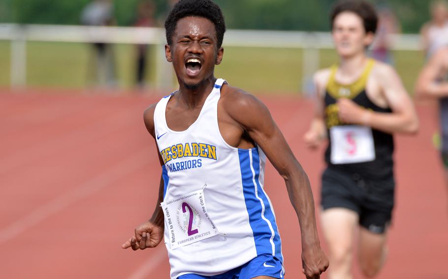 Wiesbaden’s Elijah Smith celebrates his win in the boys 3,200-meter race at the DODEA-Europe track and field championships in Kaiserslautern, Germany. Smith set a new DODEA-Europe record, winning the race in 9 minutes 44.64 seconds, breaking the record of 9:49.21 set in 2019.