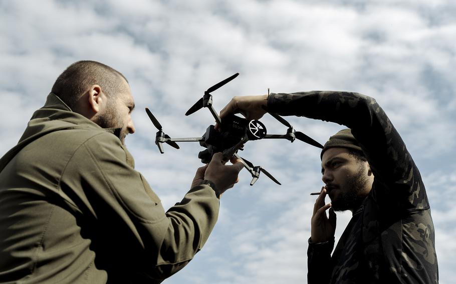 Volunteers learn how to operate a Mavic drone in Ukraine’s Kharkiv region on Sept. 26, 2022.