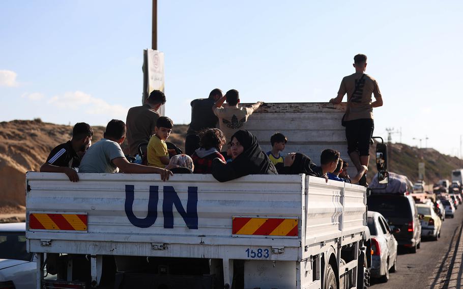 Displaced Palestinian families from the northern and central Gaza Strip evacuate toward southern Gaza on Oct. 13, 2023.