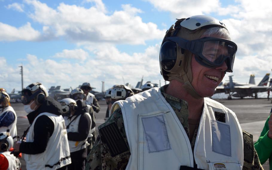 The commander of the U.S. 7th Fleet, Vice Adm. Karl Thomas, speaks to reporters aboard the aircraft carrier USS Carl Vinson in the Philippine Sea, Tuesday, Nov. 30, 2021.