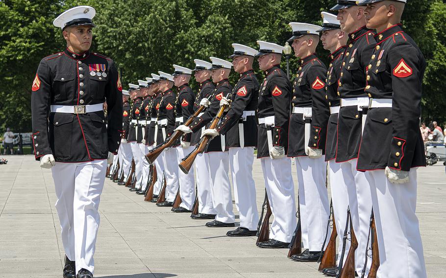 Members of a Marine Corps drill team perform outside the Lincoln Memorial on the National Mall in Washington, D.C., on Tuesday, May 31, 2022, before a crowd that included participants of a special all-female Honor Flight.