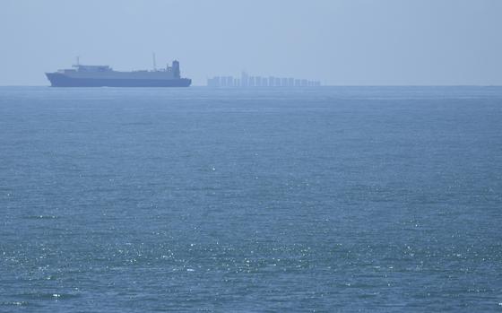 Ships move through the Taiwan Strait as seen from the 68-nautical-mile scenic spot, the closest point in mainland China to the island of Taiwan, in Pingtan in southeastern China's Fujian Province, Friday, Aug. 5, 2022. Warning of a new wave of panic, Taiwan on Tuesday, Feb. 20, 2024, protested antagonist China’s boarding of a tourist boat as tensions rise around the Kinmen archipelago that lies just off the Chinese coast but is controlled by Taiwan. 