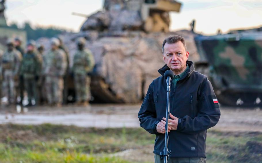 Polish Defense Minister Mariusz Blaszczak delivers remarks to attendees at the unveiling of the new Polish infantry fighting vehicle, the Badger, in Bemowo Piskie, Poland, Nov. 14, 2022. 