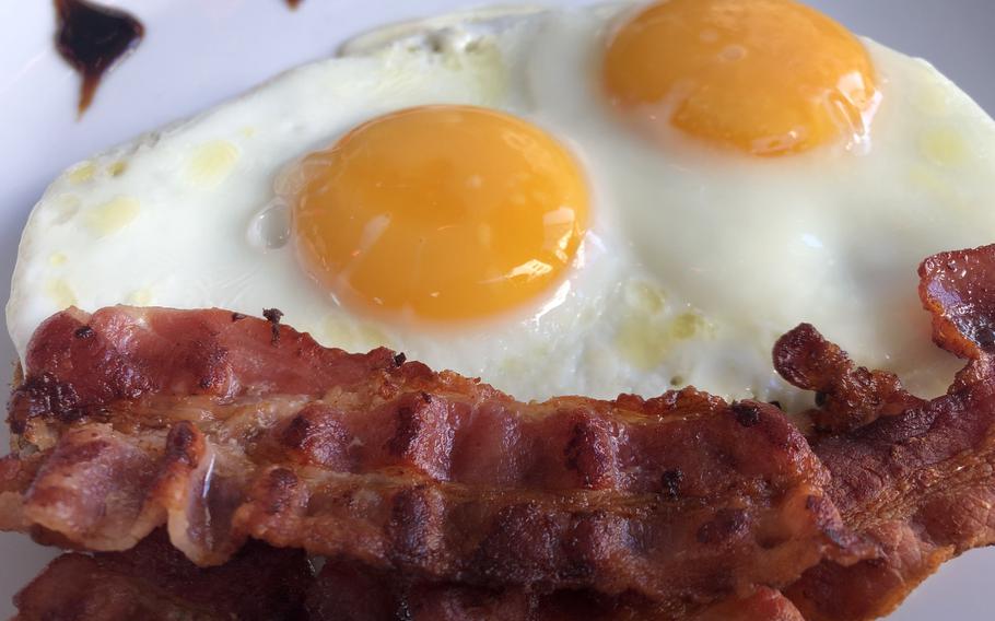 The fried eggs and bacon entree at It's Me cafe in Kaiserslautern were a hit, on April 11, 2022.