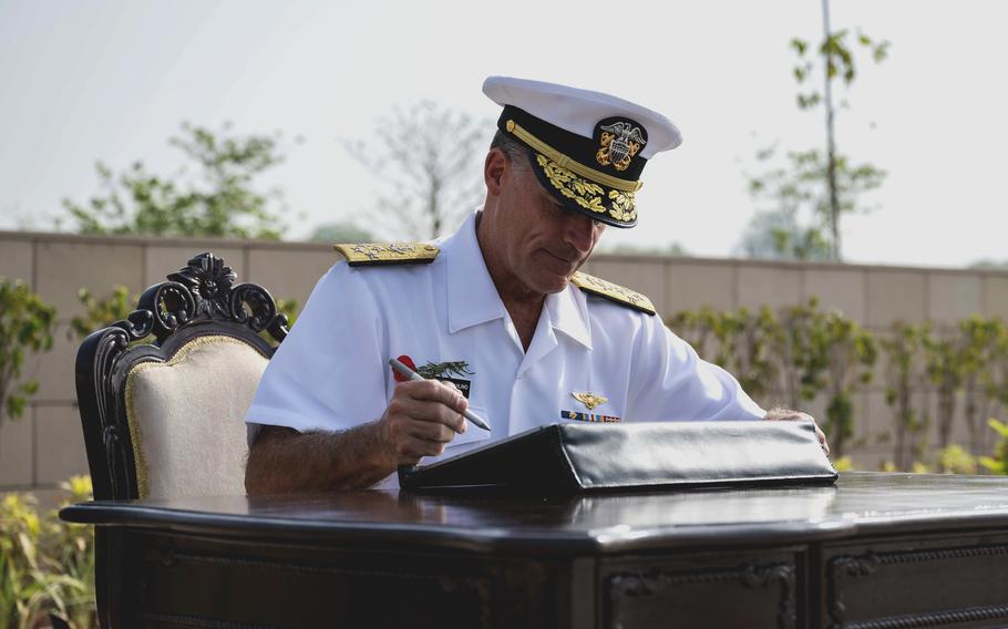 Adm. John C. Aquilino signs a digital guest book at the National War Memorial in New Delhi, India, on April 25, 2022. 