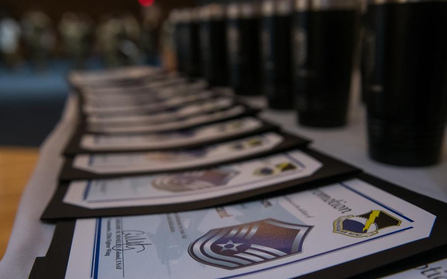 Master sergeant promotion certificates are on display at Tyndall Air Force Base, Fla., June 10, 2022. Air Force officials are projecting fewer promotions for airmen in the coming years as the service realigns its strength structure among its enlisted members.