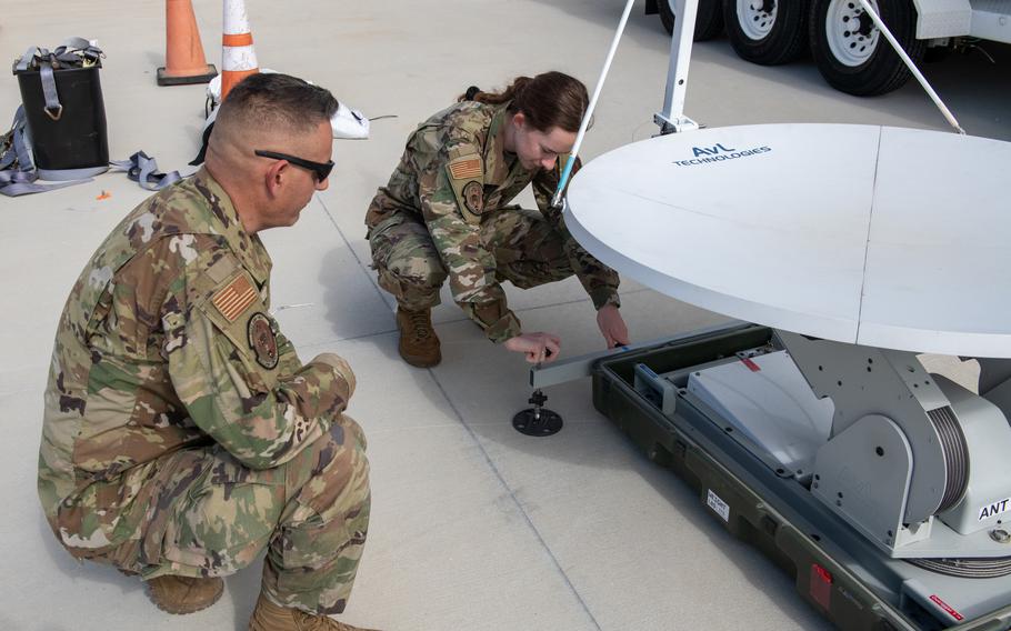 Members of the 114th Electromagnetic Warfare Squadron of the Florida Air National Guard operate a satellite at Cape Canaveral Space Force Station, Fla., in January 2023. 