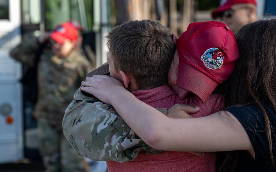 A U.S. Air Force airman assigned to the 823rd Rapid Engineer Deployable Heavy Operational Repair Squadron Engineer reunites with his family at Hurlburt Field, Fla., Sunday, April 14, 2024. 