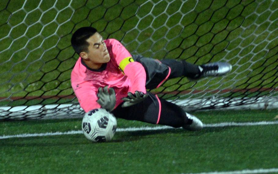 Kento Monto stops a penalty kick.