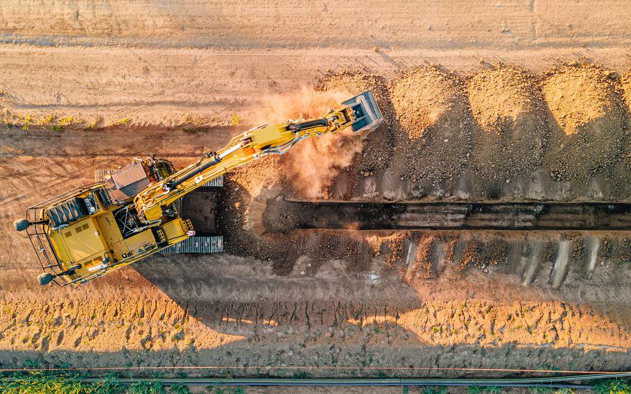 Built Robotics’ exosystem machine digs a trench.