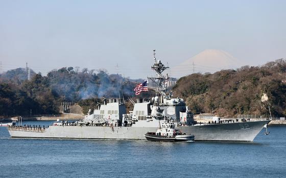 The guided-missile destroyer USS Barry departs Yokosuka Naval Base, Japan, while shifting its homeport to Naval Station Everett, Wash., Friday, Feb. 17, 2023.