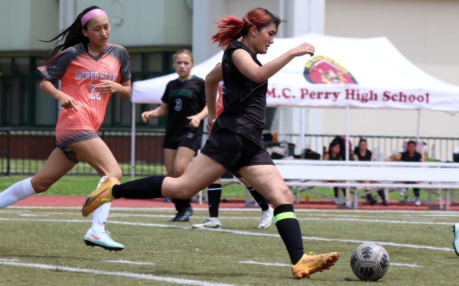 Edgren's Saige Whitmore charges up the field against the ISSH Symbas.