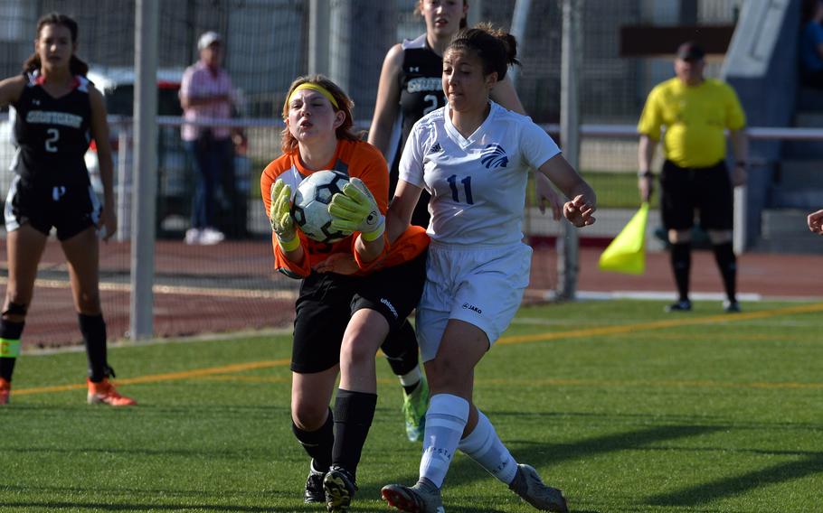 Stuttgart keeper Jasmine Lavardi scoops up the ball as she is pressured by Wiesbaden’s Essie Munoz in a Division I girls semifinal at the DODEA-Europe soccer championships in Kaiserslautern, Germany, Wednesday, May 18, 2022. The Panthers won the game 4-2 and will face Ramstein in the championship game.
