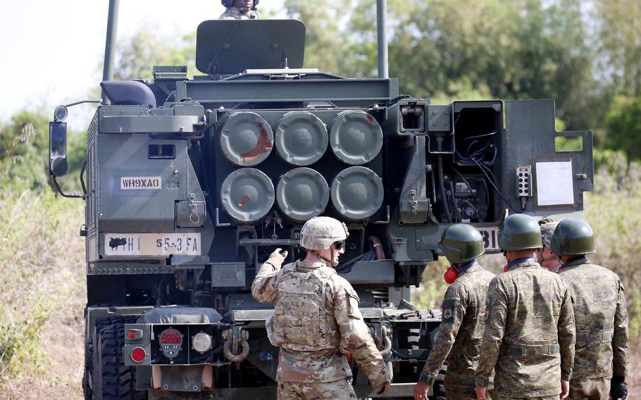 U.S. and Filipino soldiers prepare to fire a High Mobility Artillery Rocket System, or HIMARS, during the Salaknib exercise at Fort Magsaysay, Philippines, Friday, March 31, 2023.