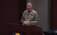 Army Col. Glenn Mellor speaks on Redstone Arsenal as he hands the job of base garrison commander to his successor. The garrison commander is compared to the mayor of a city.