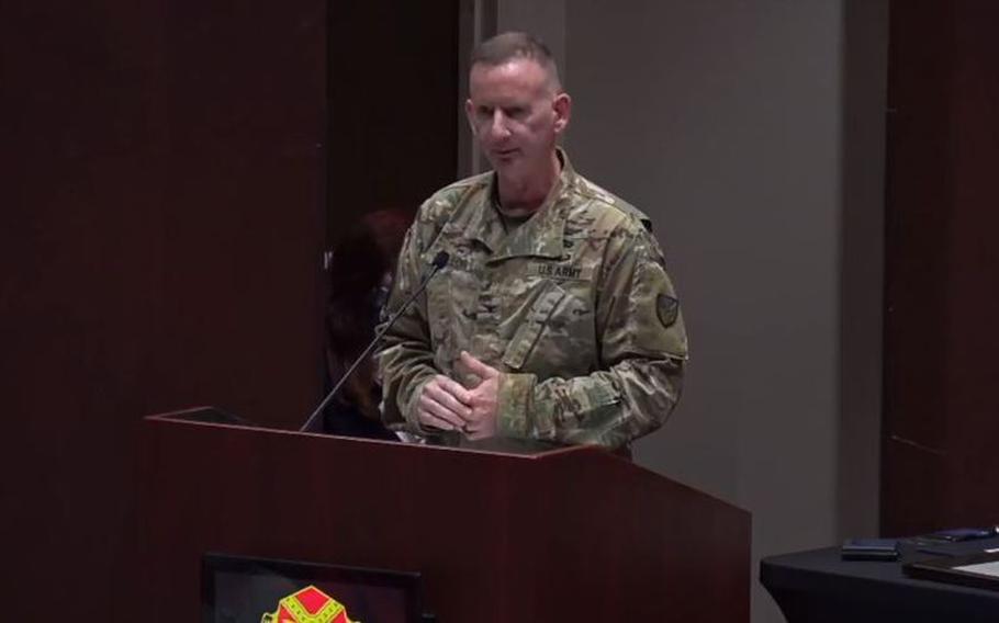 Army Col. Glenn Mellor speaks on Redstone Arsenal as he hands the job of base garrison commander to his successor. The garrison commander is compared to the mayor of a city.