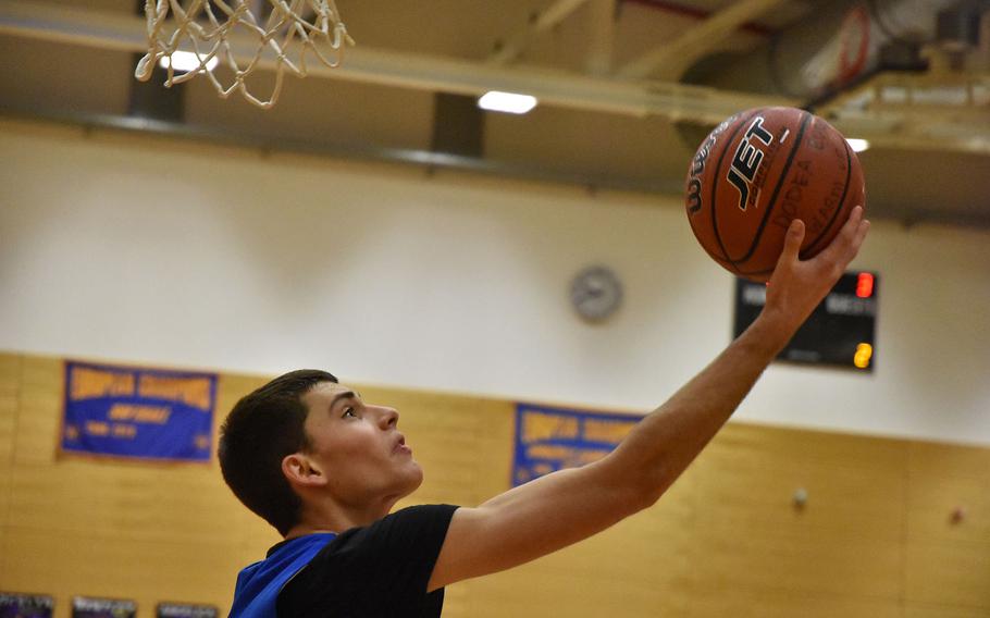 Marymount’s Patrick Gianni scores on a twisting, reverse layup Wednesday, Feb. 14, 2024, on the opening day of the DODEA European Division II Basketball Championships in Wiesbaden, Germany.
