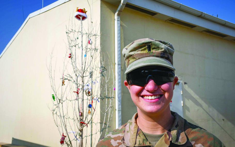 1st Lt. Hannah Levine of Eagle Troop, 2nd Squadron, 1st Cavalry Regiment found what she described as the one living tree at the remote Camp Dahlke West in Afghanistan, Dec. 24, 2018. She had the tree chopped down and decorated it. “I was raised in a family where we don’t believe in fake Christmas trees,” said Levine, 24, of Sugarloaf, Pa.